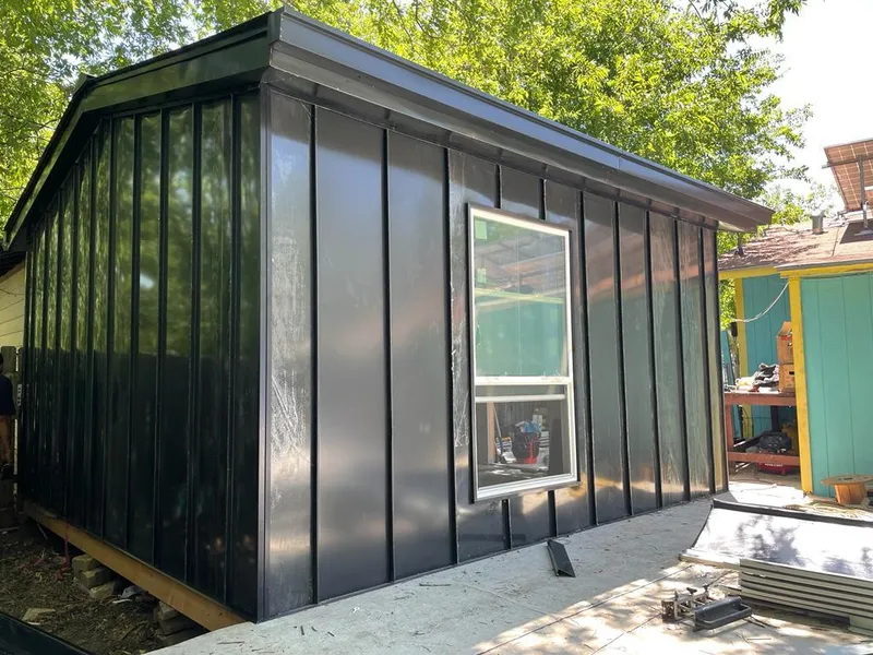 Black standing seam metal wall panels for Metal Roof Installation in Houghton