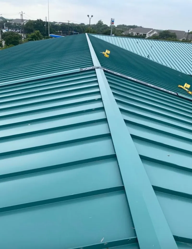 Green commercial metal roof ridge and valley for Metal Roof Repair in Houghton