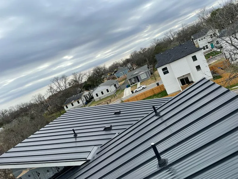 Standing seam metal roof panels with vents for Skylight Repair in Houghton